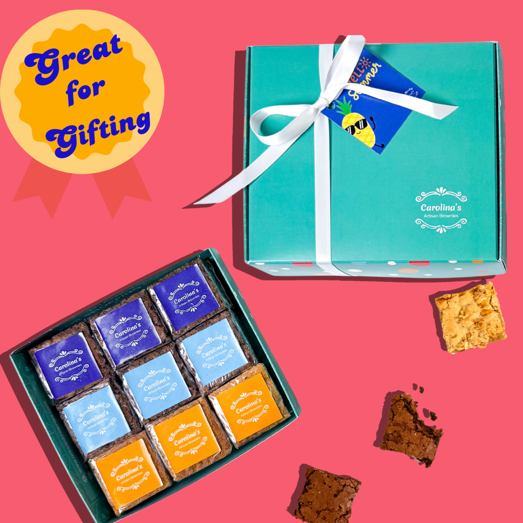 Gift boxes with candies and a teal box with a white ribbon on a pink background.